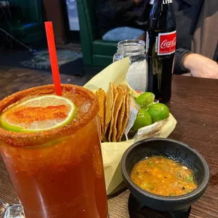 a bloody drink and a bowl of chips