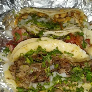 Chicken, carnita and beef tacos