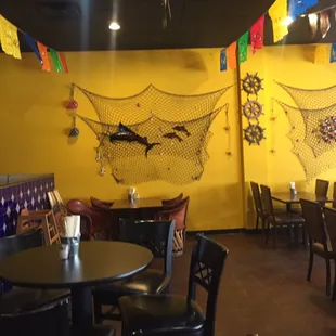 a restaurant with tables and chairs