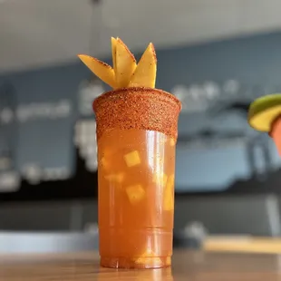 a close up of a drink with a garnish on top