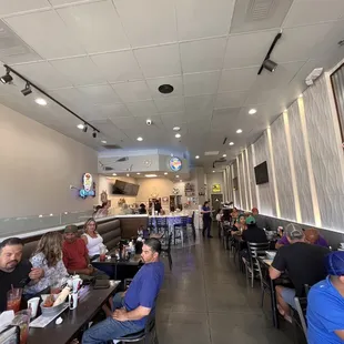 Indoor seating with a bar and TVs