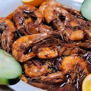a plate of shrimp and cucumbers