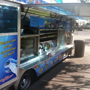 a food truck parked on the side of the road