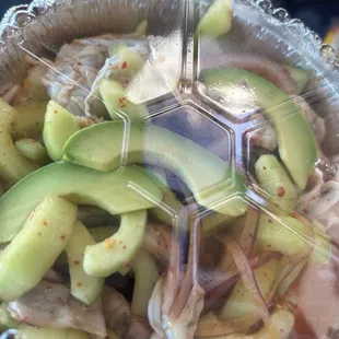 avocado and meat in a plastic container