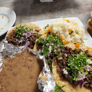 3 steak taco dinner with cilantro and onion plus rice and beans.  Wonderful