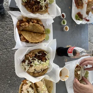 a table full of tacos and beer