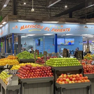 a fruit stand in a grocery store