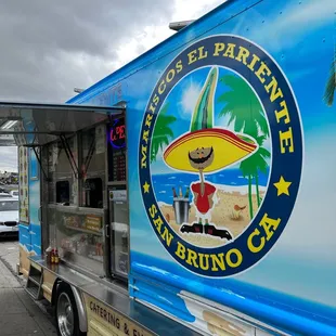 a food truck parked on the side of the road