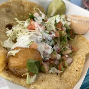 a fish taco on a plate