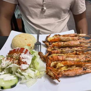 a plate of grilled shrimp