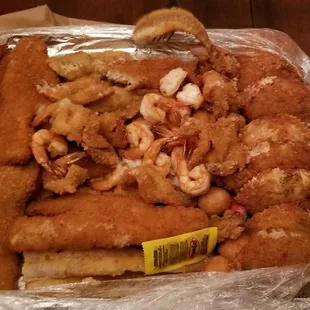 a tray of fish and shrimp