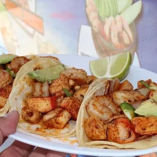 a plate of shrimp tacos