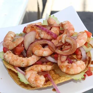 a plate of shrimp tacos