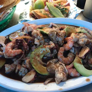 a plate of shrimp and avocado