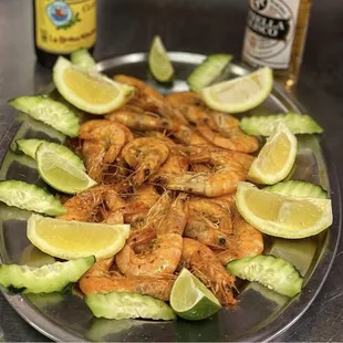 a plate of shrimp and cucumbers