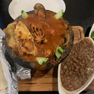 Cooked Seafood Molcajete- Served boiling HOT and Homemade corn tortillas