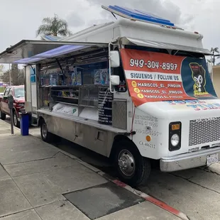 Front of truck with social media and phone number to call ahead orders