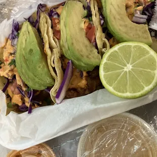 Clearer picture of three fish tacos for $10 with a juicy line and  salsas
