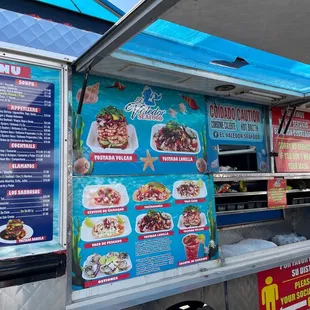 a food truck with menus