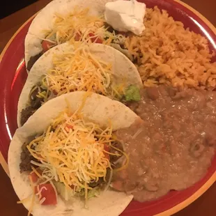 Carna asada(steak) tacos with rice and refried beans