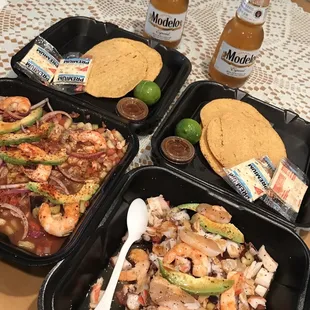 a table with three trays of food