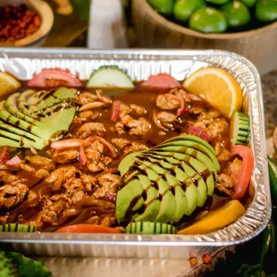 a pan of chicken and avocado