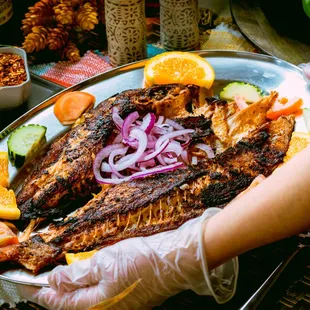 a plate of grilled fish