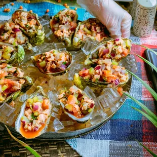 a platter of clams with seafood