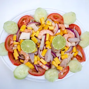 a plate of shrimp and vegetables