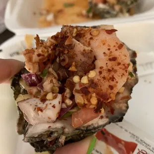 a hand holding a piece of food