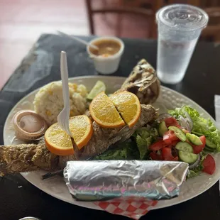 New menu item! Mojarra con arroz y ensalada. Did not disappoint! Food takes a long time because it's so fresh. I'll be here all of lent.