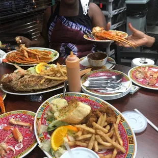 Crab legs, red snapper, salmon dinner, and shrimp