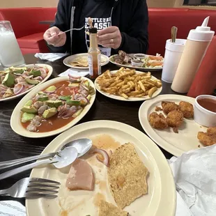 a boy eating a meal at a restaurant