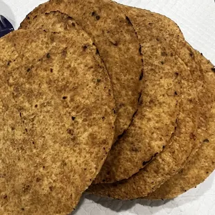 three tortillas on a napkin