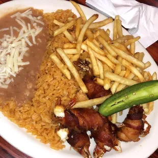 Bacon wrapped shrimp , beans , rice and instead of lettuce and tomatoes on the side they gave us the choice of fries instead .