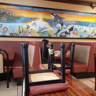 a dining area with tables and chairs