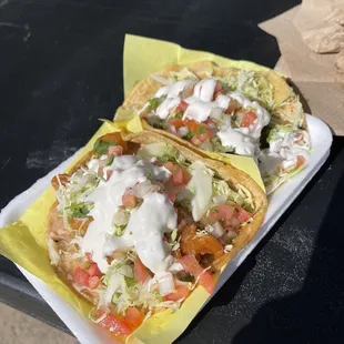 two tacos sitting on a table