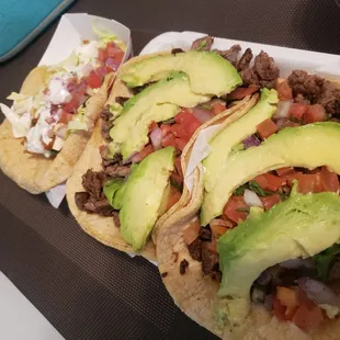 Fish taco on left, carne asada tacos on right! Yes please