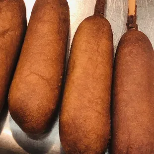 five hot dogs on a stick
