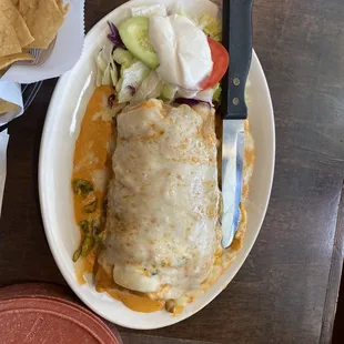 Burrito with shrimp and crema sauce