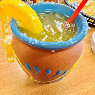 a mexican drink with a slice of orange