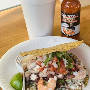 Campechana (mix seafood cocktail) and Tostada Mixta. Bottled hot sauce a MUST.