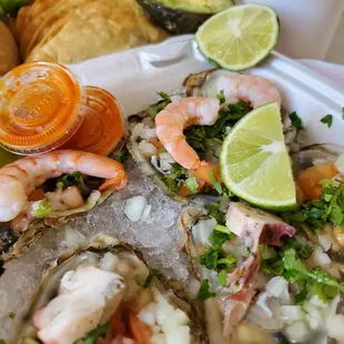 a plate of oysters and shrimp