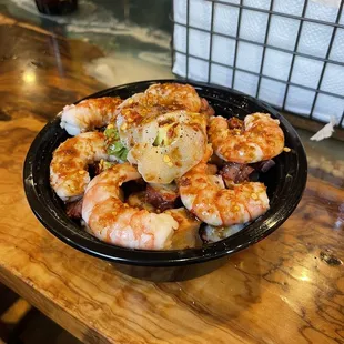 a plate of shrimp and potatoes