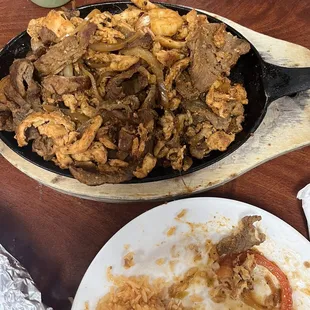 a plate of food and a spoon