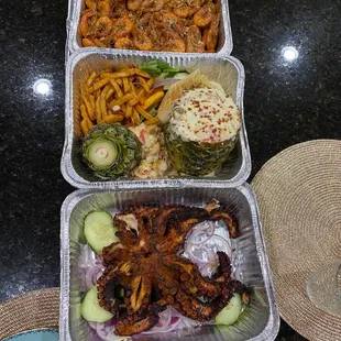 three containers of food on a table