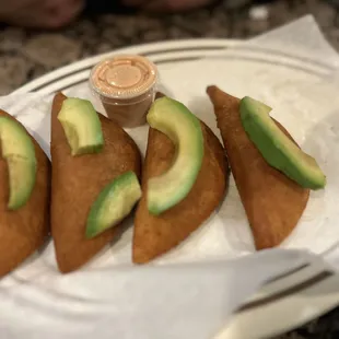 a plate of avocado sandwiches