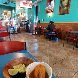 a bowl of soup and a plate of food on a table