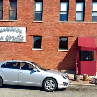 a car parked in front of a building