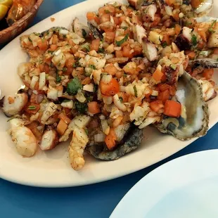 a plate of seafood and rice